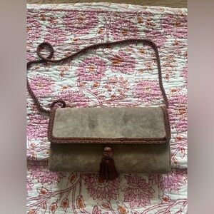 Vintage Suede bag with tassel detail and rope handle. Tan bag/brown details.
